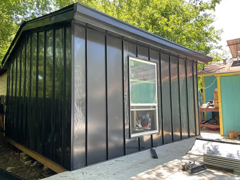 Black standing seam metal wall panels for Roof Inspection in Lake Mills