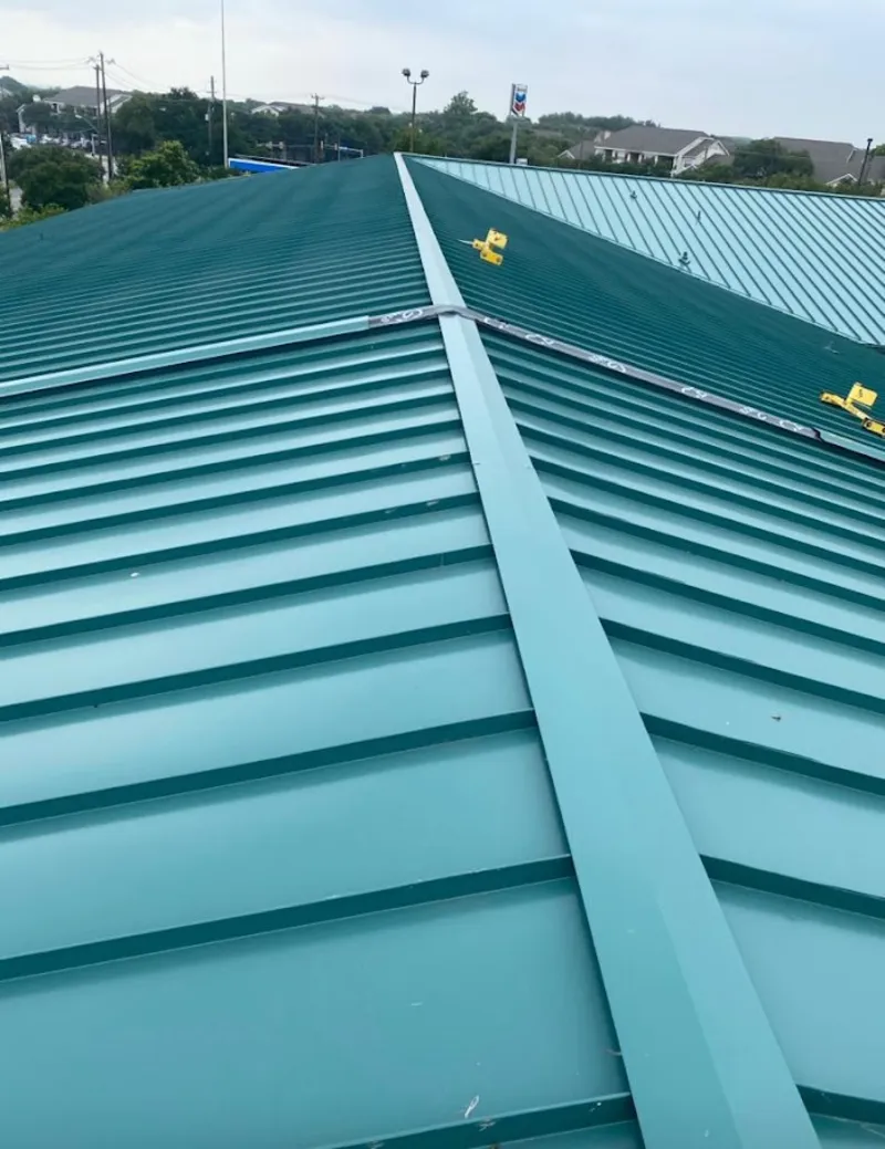 Green commercial metal roof ridge and valley for Metal Roof Repair in Lake Mills
